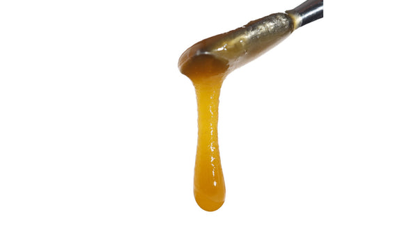 Image of Sauce Warehouse Super Sour Space Candy CBD Live Resin dripping from dab tool