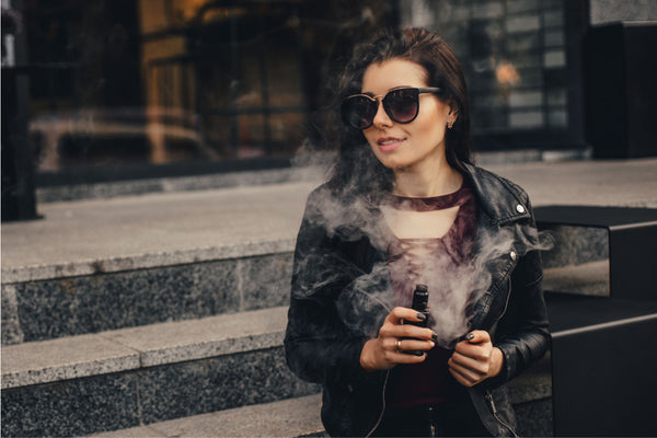 Image of woman vaping CBD