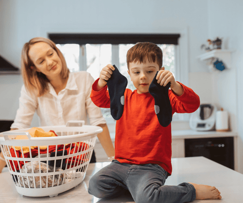 young kids sorting socks