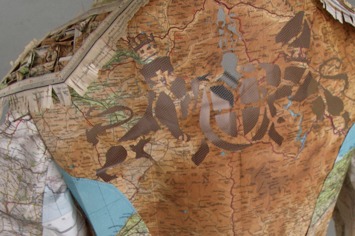 Detail of a brass band jacket made from recycled paper maps of the UK