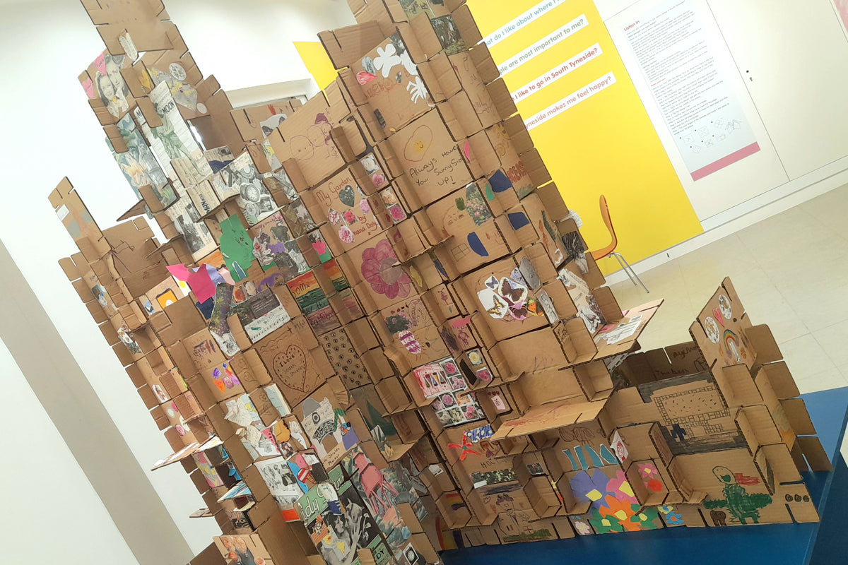 Cardboard slotted structure with collage material in The Word exhibition space in South Shields