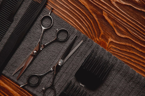 Scissors and combs in flat lay