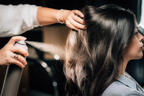 salon applying hair spray - finishing spray