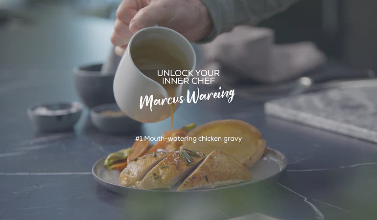 Marcus Wareing pouring a jug of chicken gravy