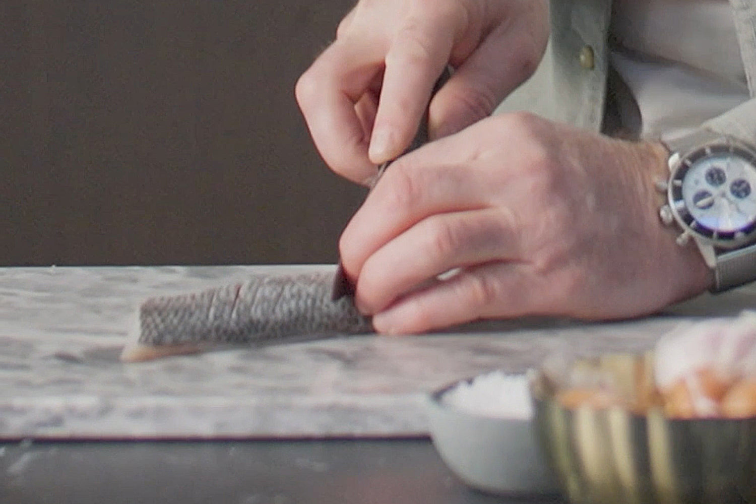 Marcus Wareing scores the fish skin