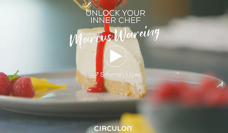 A slice of cheesecake being drizzled