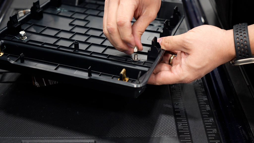 Bolting the MOLLE Tech Plate to the Center Console Lid Plastic