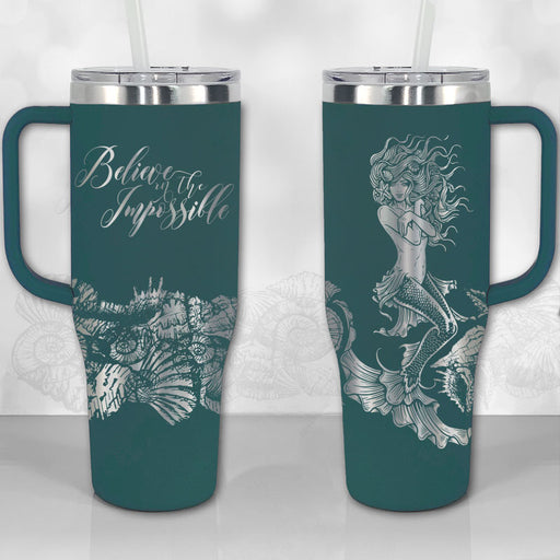 https://cdn.shopify.com/s/files/1/0452/5883/4070/products/40oz-tumbler-with-handle-mermaid-believe-impossible-thirst-quencher-lid-insulated-travel-mug-dark-teal_512x512.jpg?v=1677395857