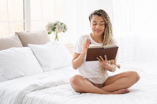 woman reading before bed