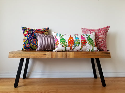 Various bright and vibrant hand made throw pillows