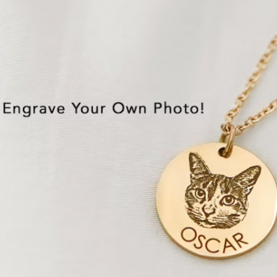 Custom gold necklace example featuring a cat's face and his name, 'Oscar.' The photo reads 