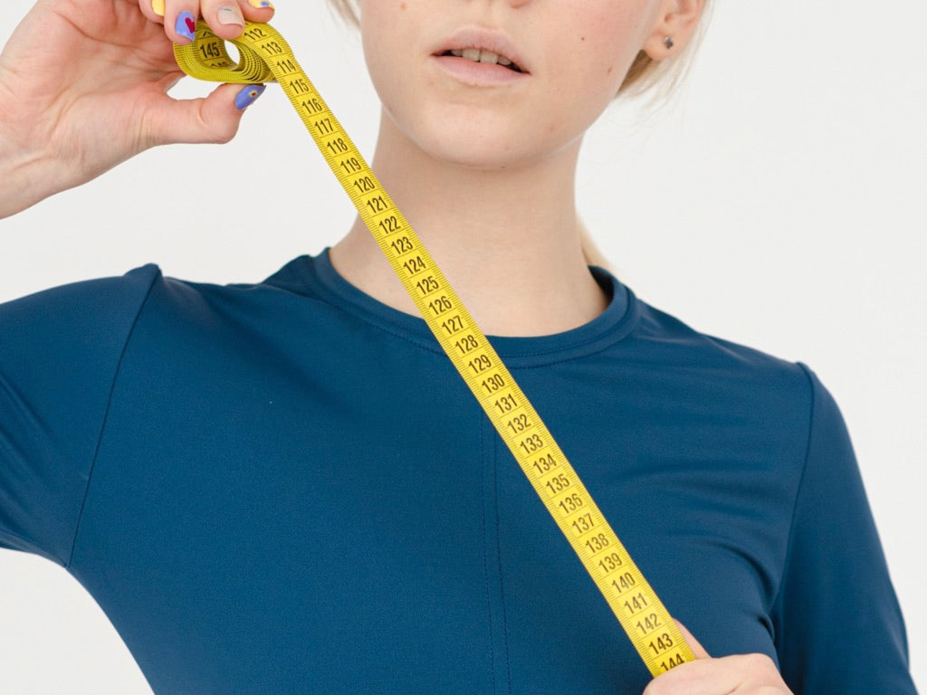 Woman Tape Measure Workout Metrics