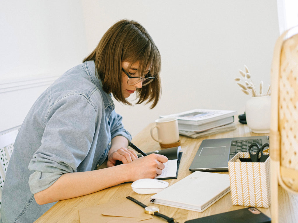 Work From Home Virtual Stretch Class Woman at Desk