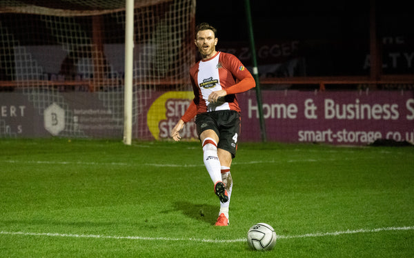 A detailed view of the Altrincham shirt sponsor Football Against News  Photo - Getty Images