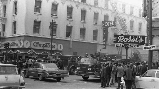 A black and white image showing Compton's Cafeteria at the busy intersection of The corner of Turk and Taylor in San Francisco 