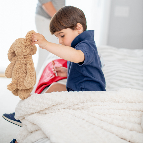 Boy playing activities indoor on snow day sick day