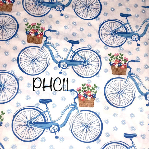 blue bicycles with baskets on white background