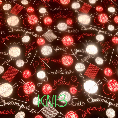 knitting terms on black with red, white and grey yarn balls