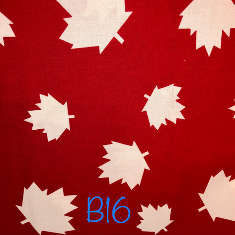 white maple leafs on red background