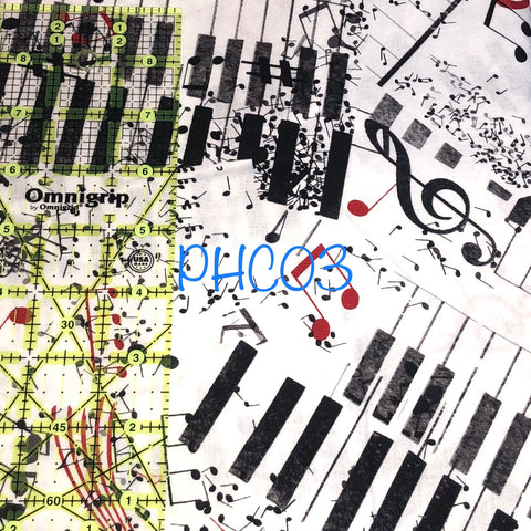 music notes and piano keys on white