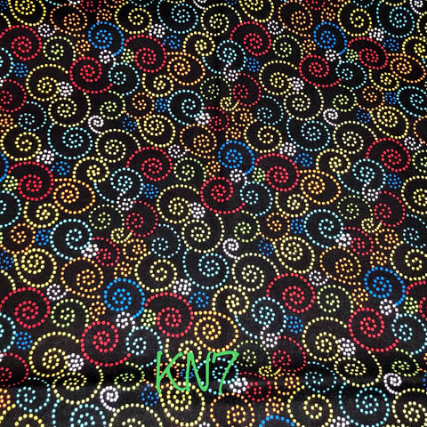 multi-coloured yarn swirls on black