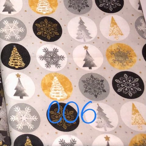 round silver and gold christmas stickers on light grey