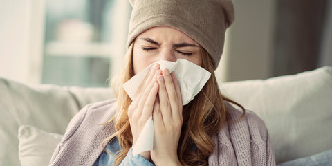 5 Ways to Boost Your Immunity: Woman Sneezing