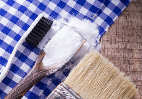 Baking Soda and Brush on Wooden Table