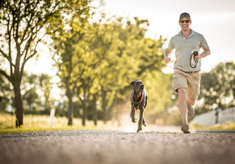 Man Running with a Dog