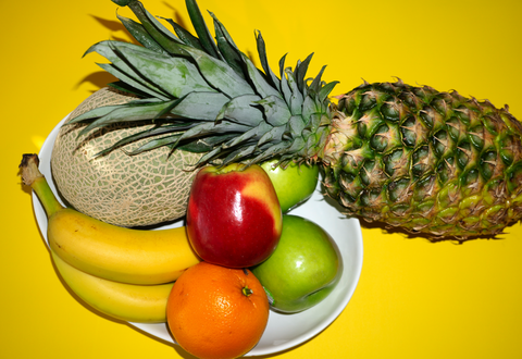 Plate of Fruits on Yellow Background