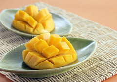 Two Plates of Sliced Mangoes