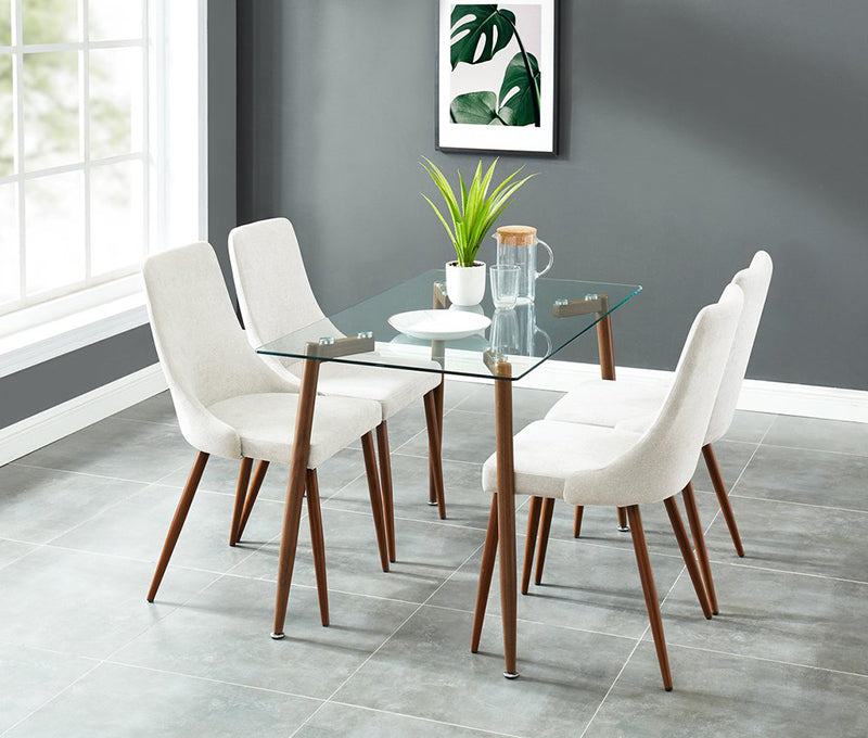 Glass dining table with four white chairs