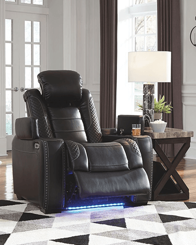 Leather power recliner in midnight colour with stitching, adjustable headrest, and underneath LED lighting in blue