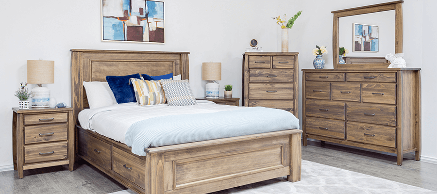 Bedroom set including bed, mirror, dresser, chest and nightstand with curved edges and rustic finish