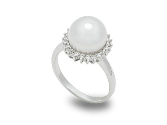 Pearl ring with diamond accents on a white background