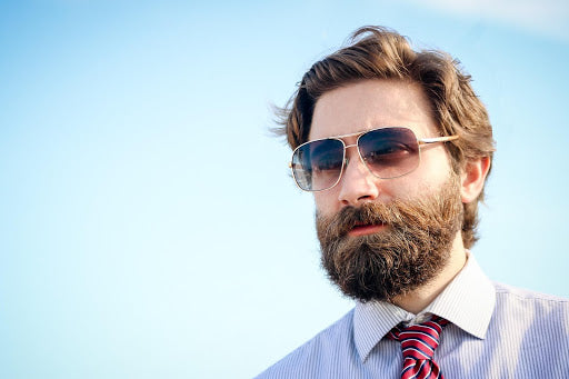 man with sunglasses wearing a tie