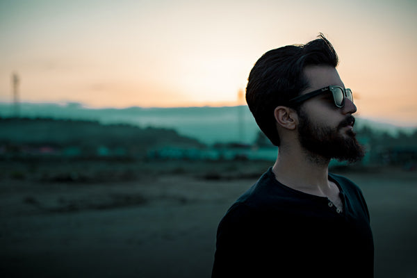 A man with a beard wearing sunglasses