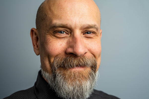 a close up shot of man with beard