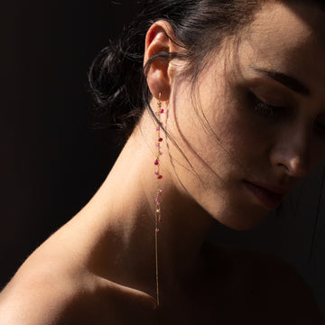 model wearing a dangly necklace from our deco decadence collection