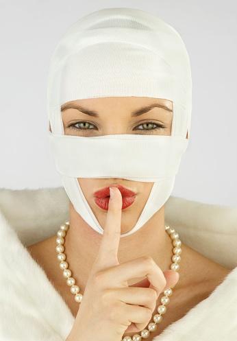Woman Whispering With Thread Lifts On Her Face