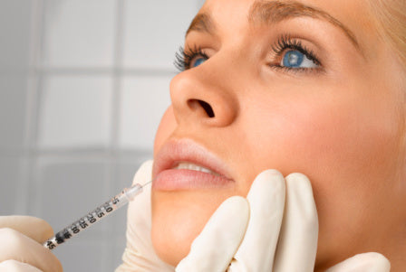 Woman having filler treatment done