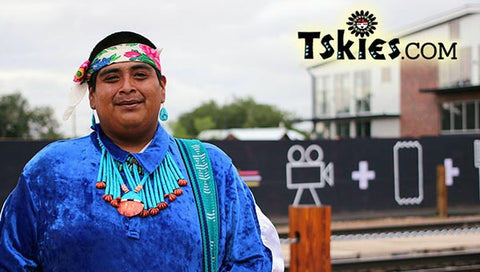 smilingn acoma dancer wearing turquoise jewelry