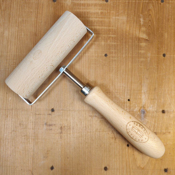 Pasta cutter wheel in brass with single toothed blade, olive handle