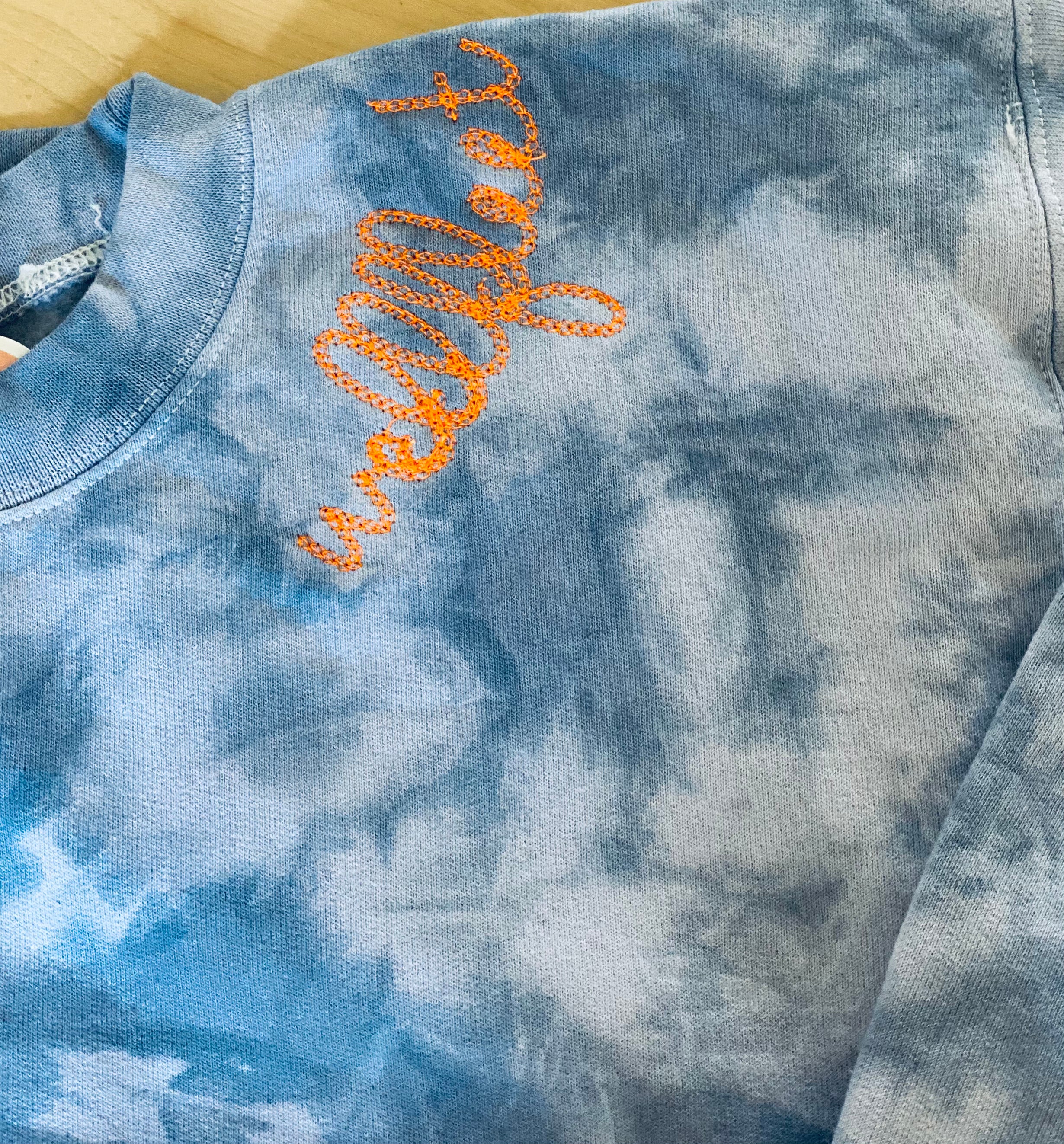 Indigo tie dye chainstitch Wellfleet sweatshirt orange text