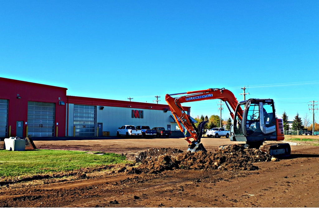 falcon rentals excavator on a hot sunny job site