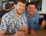 Photo of two men wearing bamboo fabric shirts. One is Paradise Palm print, the other is Bush Possum print. Available to purchase from Stewart's Menswear, Mullumbimby