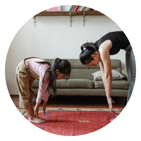 mother-and-daughter-stretching-to-gain-mobility