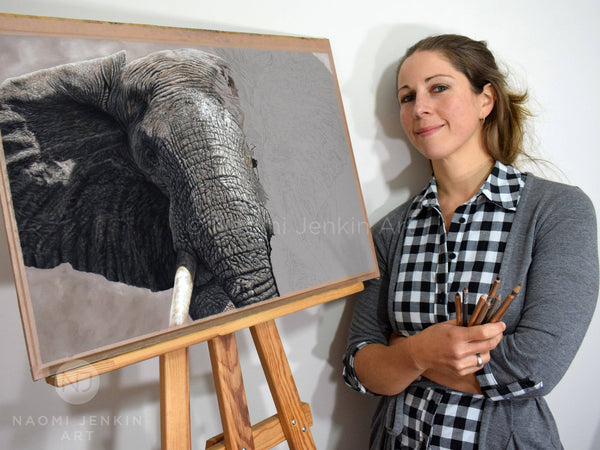 Wildlife artist Naomi Jenkin with her elephant drawing "The Elephant Charge"