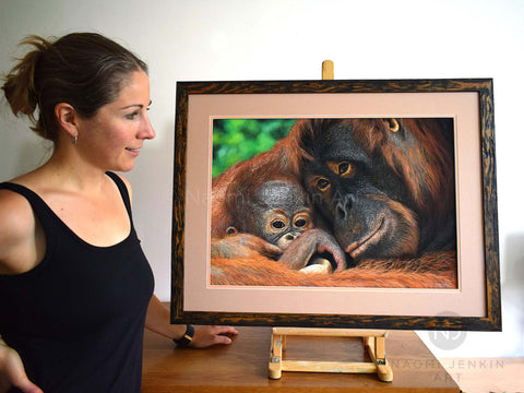 Wildlife artist Naomi Jenkin with her orangutan painting Hold Me Closer.