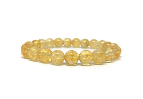 Citrine bracelet against a clear background.
